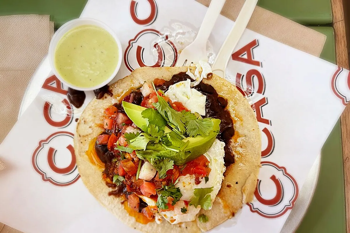 Breakfast taco with beef chorizo egg avocado tomato salsa queso fresco and cilantro