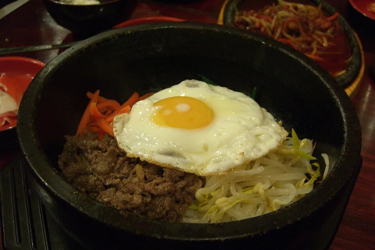 Stone bowl bibimbap with beef rice vegetables and fried egg