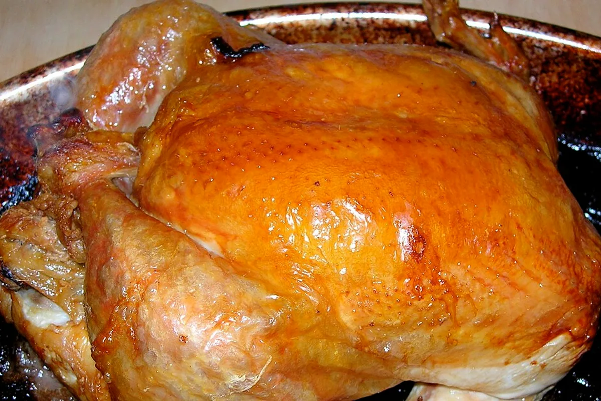 Whole lemon and garlic roast chicken with deeply browned skin