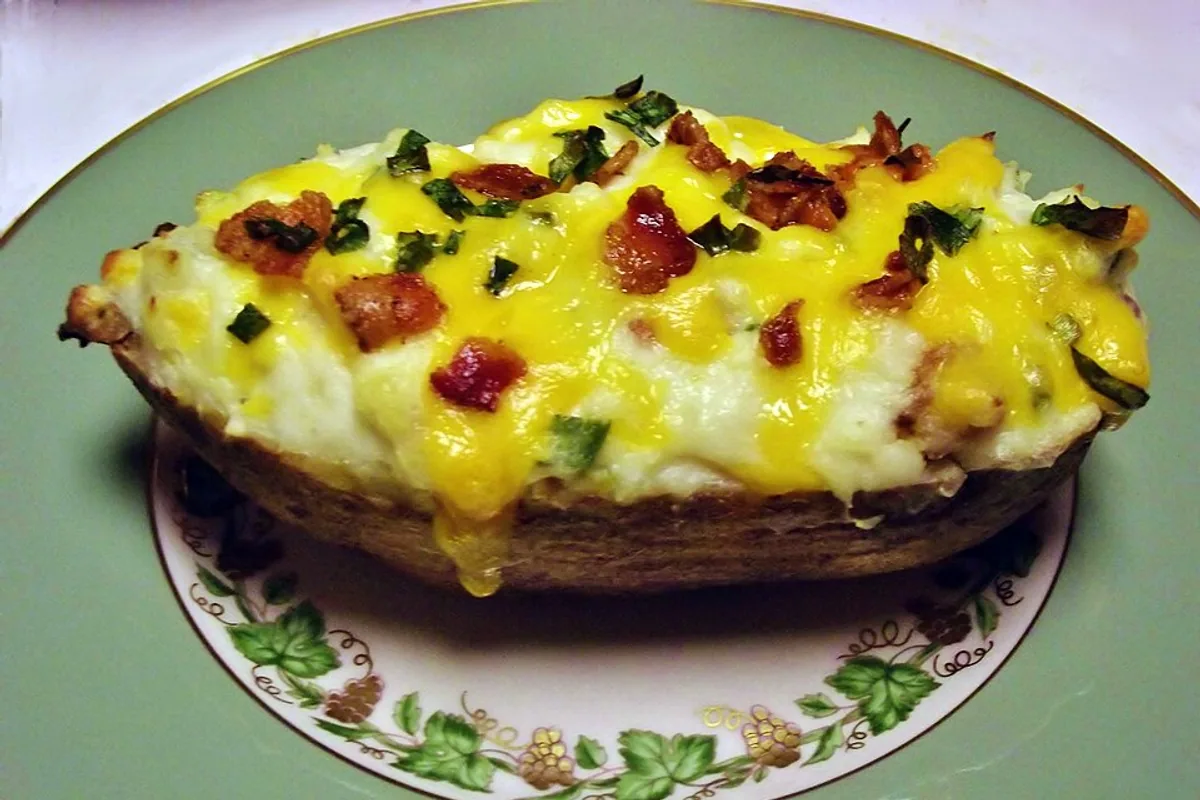 Twice-baked potato with cheddar bacon and scallions