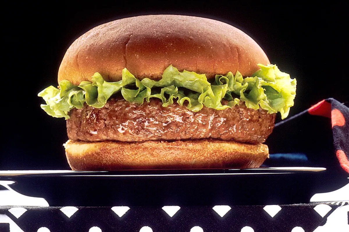 Turkey burger on a bun with lettuce and tomato